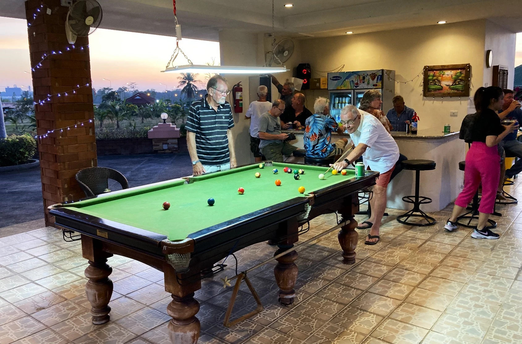 Pooltable and a bar at the poolarea